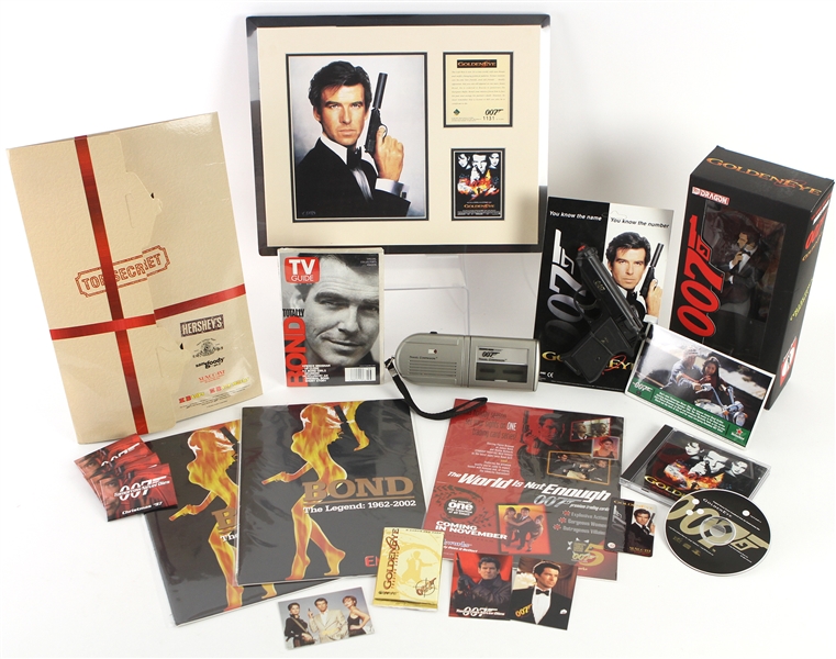 1990s-2000s James Bond Memorabilia Collection - Lot of 20 w/ MIB Action Figure, Replica Pistol, Adverts, Pinbacks, Trading Cards & More