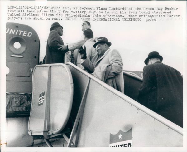 1960 Vince Lombardi Boarding Plane For Championship Game Type 1 8" x 10" Photo - SPORT Magazine 