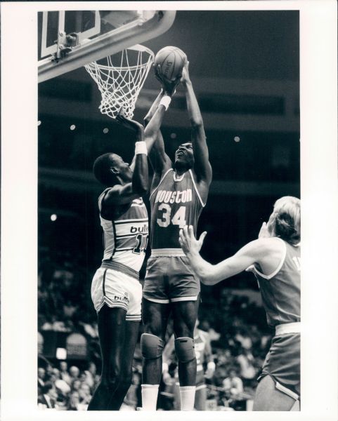 1986 Manute Bol Washington Bullets & Hakeem Olajuwon Houston Rockets "TSN Collection Archives" Original Type 1 8" x 10" Photo (Sporting News Collection Hologram/MEARS Type 1 Photo LOA)
