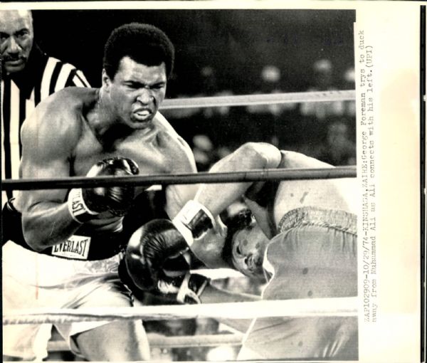 1974 Muhammad Ali Hits George Foreman "Chicago Sun-Times Archives" Original 8" x 10" Photo (Chicago Sun-Times Hologram/MEARS Photo LOA)