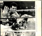 1974 Muhammad Ali Hits George Foreman "Chicago Sun-Times Archives" Original 8" x 10" Photo (Chicago Sun-Times Hologram/MEARS Photo LOA)
