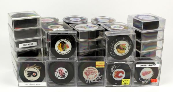 Collecton of Signed NHL Pucks - 63 With 17 Hall of Famers - (MEARS LOA) 