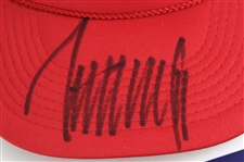Donald Trump & Bobby Valentine Signed Caps, Stickers, and Newspaper (Lot of 6)(JSA)