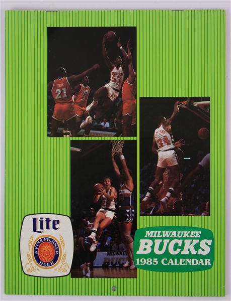 1985 Milwaukee Bucks Multi Signed Calendar w/ 9 Signatures Including Don Nelson, Sidney Moncrief, Randy Breuer & More (JSA)