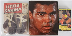 1960s-90s Muhammad Ali & Boxing Memorabilia Collection - Lot of 3 w/ Little Champ Boxing Gloves on Original Card, Muhammad Ali Hardcover Book and Kings of the Square Ring VHS