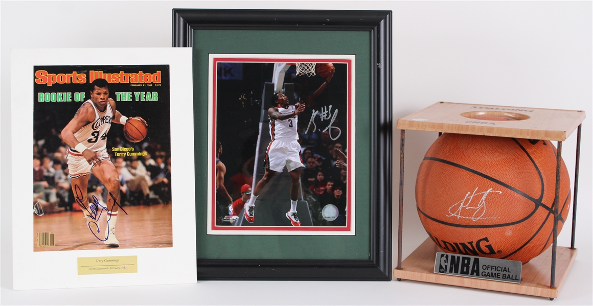 2010s Milwaukee Bucks Signed Items - Lot of 3 w/ Andrew Bogut ONBA Stern Basketball, Brandon Jennings 13" x 16" Framed Photo & Terry Cummings 10.5" x 14" Matted SI Cover (JSA)